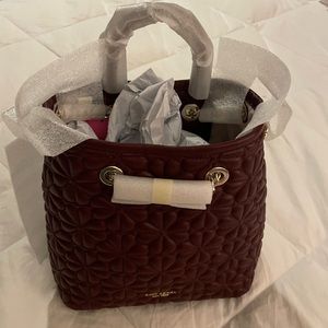 Brand New Kate Spade Handbag, Color is a deep plumb, Bucket shape, about 9x9 1/2
